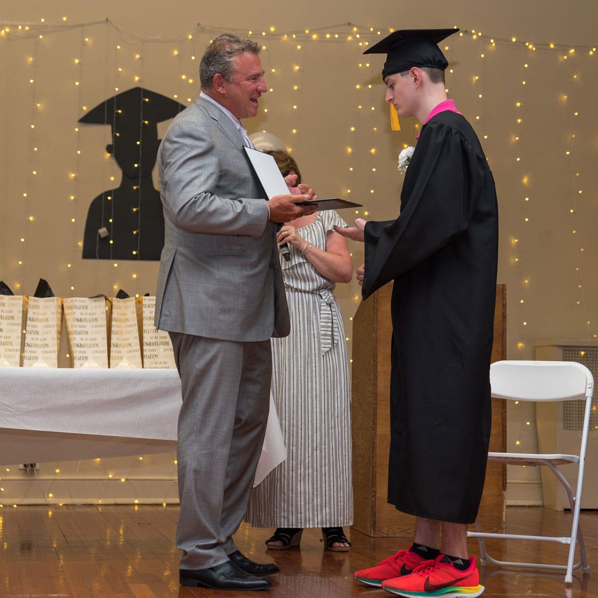Gersh Academy Student Getting his Diploma From Kevin Gersh